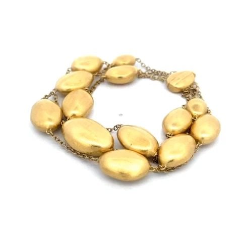 MARCO BICEGO 18K BRACELET SIVIGLIA 3 STRAND 18K YELLOW GOLD OVAL BEADS: MARCO BICEGO 18K BRACELET SIVIGLIA 3 STRAND 18K YELLOW GOLD OVAL BEADS From the Siviglia Collection by Marco Bicego, this chic fashionable bracelet is crafted from 18k yellow gold featuring 3 strand o