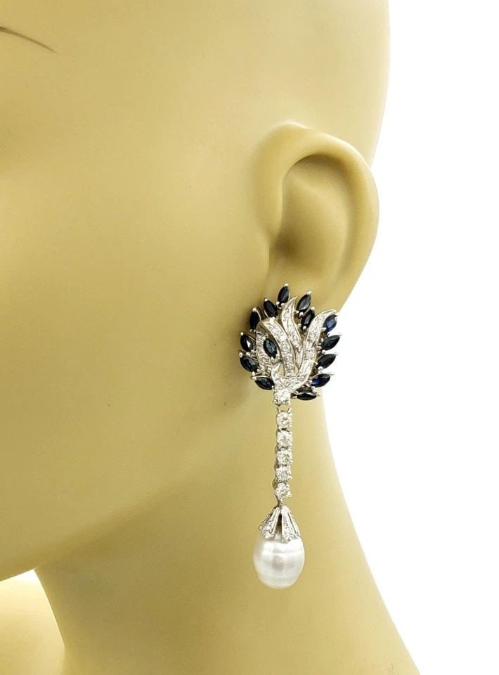 ESTATE 9CT DIAMOND SAPPHIRE PEARL 18K GOLD FANCY DANGLE EARRINGS: ESTATE 9CT DIAMOND SAPPHIRE PEARL 18K GOLD FANCY DANGLE EARRINGS Estate 9ct Diamond Sapphire Pearl 18k Gold Fancy Dangle Earrings Description This gorgeous pair of Estate dangle earrings are crafted f