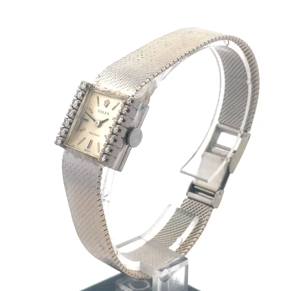 ROLEX PRECISION VINTAGE GOLD WATCH 18K WHITE DIAMOND SQUARE MANUAL WIND: The lovely Rolex Precision vintage hold watch is a luxurious timepiece for women, featuring a square 18k white gold case with a diamond bezel and stick indexes. This manual wind Swiss-made watch has a