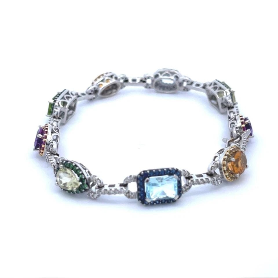 LOVELY DIAMOND MULTICOLOR GEMS 18K WHITE GOLD BRACELET: LOVELY DIAMOND MULTICOLOR GEMS 18K WHITE GOLD BRACELET Lovely Diamond Multicolor Gems 18k White Gold Bracelet Description This is a beautiful bracelet, crafted from 18k white gold featuring 9 assorted