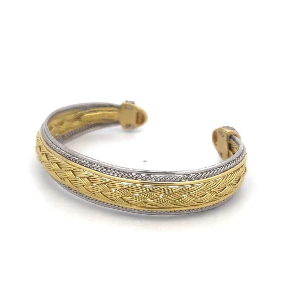 RIZZO GOLD CUFF BRACELET 18K TWO TONE BRAIDED ROPE STYLE BAND: RIZZO GOLD CUFF BRACELET 18K TWO TONE BRAIDED ROPE STYLE BAND The Rizzo Gold Cuff Bracelet is a stunning piece of fine jewelry crafted with 18K yellow and white gold. The fine multiwire braided style 