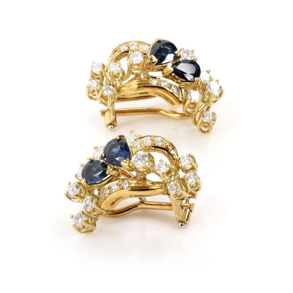 18K DIAMOND & SAPPHIRE YELLOW GOLD FLORAL POST CLIP EARRINGS: 18K DIAMOND & SAPPHIRE YELLOW GOLD FLORAL POST CLIP EARRINGS Yellow Gold Diamond & Sapphire Floral Post Clip Earrings Description This beautiful pair of earrings are crafted from 18k yellow gold with 