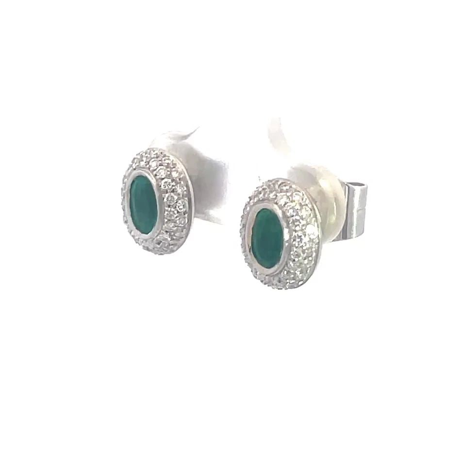 H.STERN EMERALD GOLD EARRINGS PAVE DIAMOND 18K WHITE OVAL STUDS PAPER: Elegant and authentic from H.Stern, these earrings features oval stud designs that exude timeless elegance. Each earring is masterfully crafted from 18k white gold, providing a luxurious backdrop for 