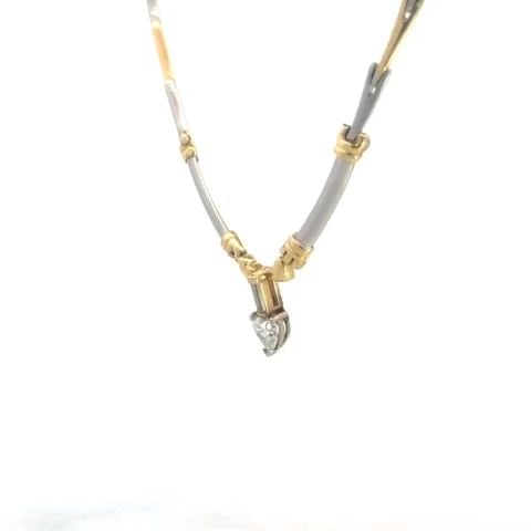 HEART DIAMOND GOLD PENDANT 14K TWO TONE BONE LINK NECKLACE: HEART DIAMOND GOLD PENDANT 14K TWO TONE BONE LINK NECKLACE This lovely necklace is crafted from 14k yellow and white gold. The pendant features a heart shaped frame with a heart cut diamond accented o