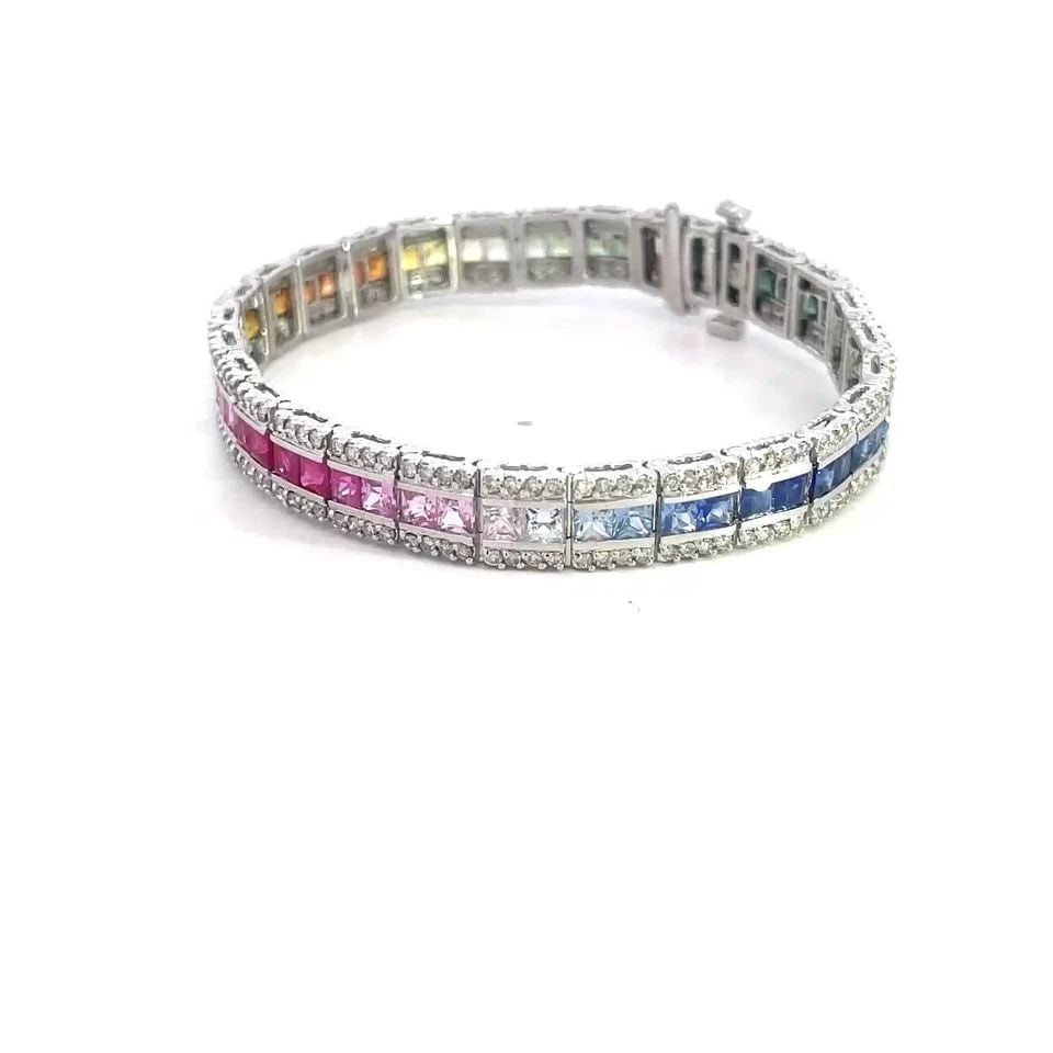 RAINBOW SAPPHIRE GOLD BRACELET DIAMOND 13K WHITE GOLD MULTI-COLOR: RAINBOW SAPPHIRE GOLD BRACELET DIAMOND 13K WHITE GOLD MULTI-COLOR This is a gorgeous tennis bracelet, it is crafted from 13k white gold with a polished finish featuring flexible square links joined to