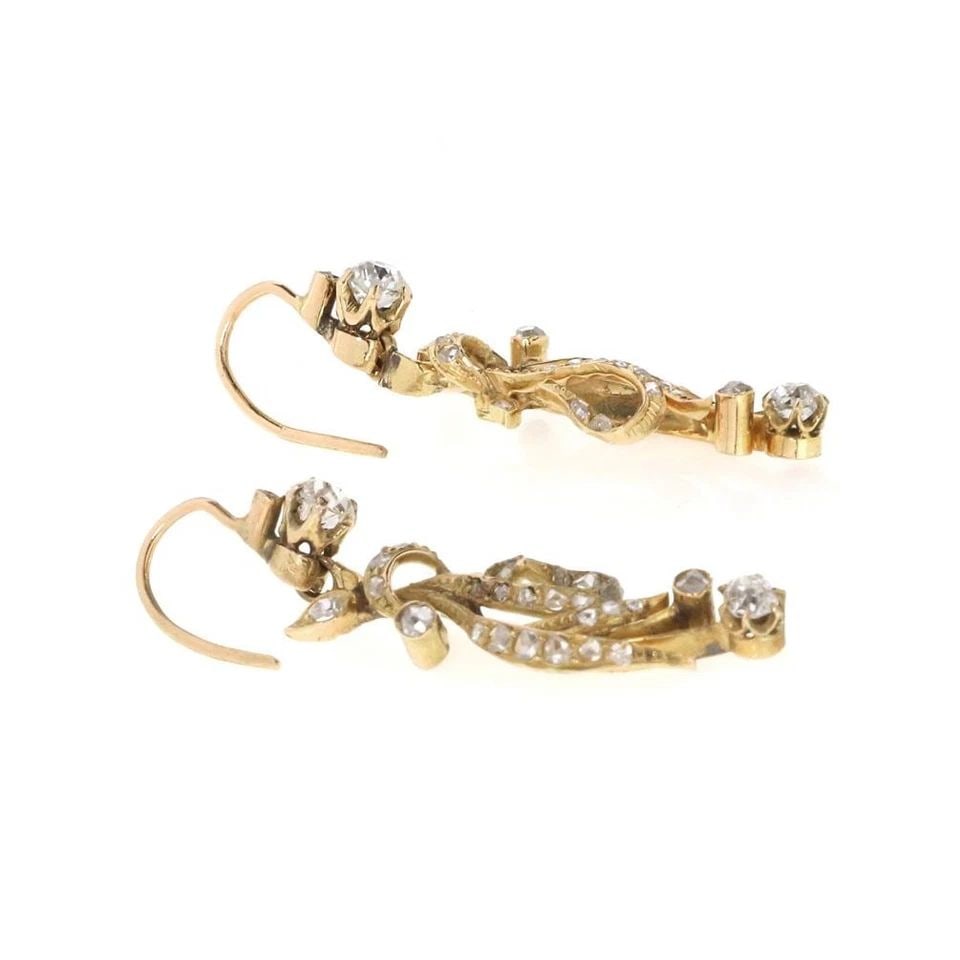 VICTORIAN OLD MINE ROSE CUT DIAMOND 17K YELLOW GOLD EARRINGS: VICTORIAN OLD MINE ROSE CUT DIAMOND 17K YELLOW GOLD EARRINGS These Victorian Old Mine Rose Cut Diamond 17k Yellow Gold Earrings are a stunning piece of fine jewelry from the Victorian era. The dangle/