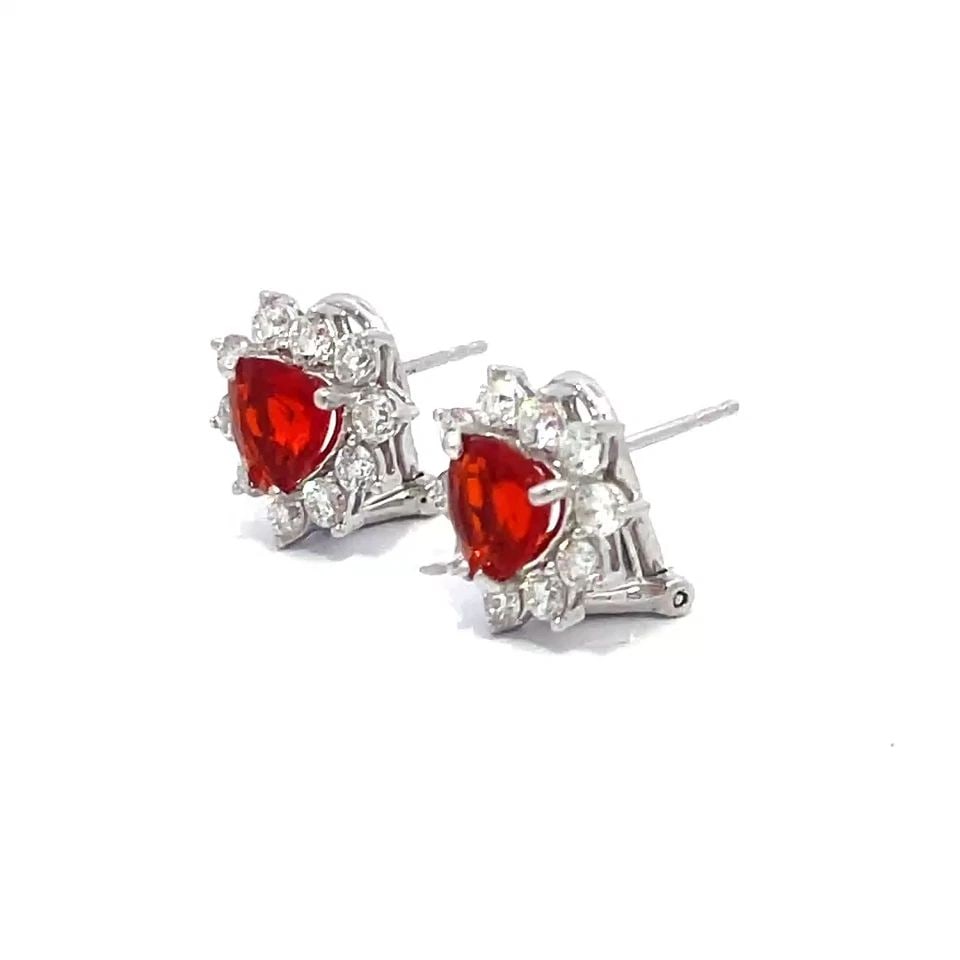 DIAMOND GOLD EARRINGS MEXICAN OPAL 2.70CT 18K WHITE POST CLIP: DIAMOND GOLD EARRINGS MEXICAN OPAL 2.70CT 18K WHITE POST CLIP These adorable huggie earrings are crafted from 18k white gold featuring a small triangle shape with a stunning trillion cut Mexican orang
