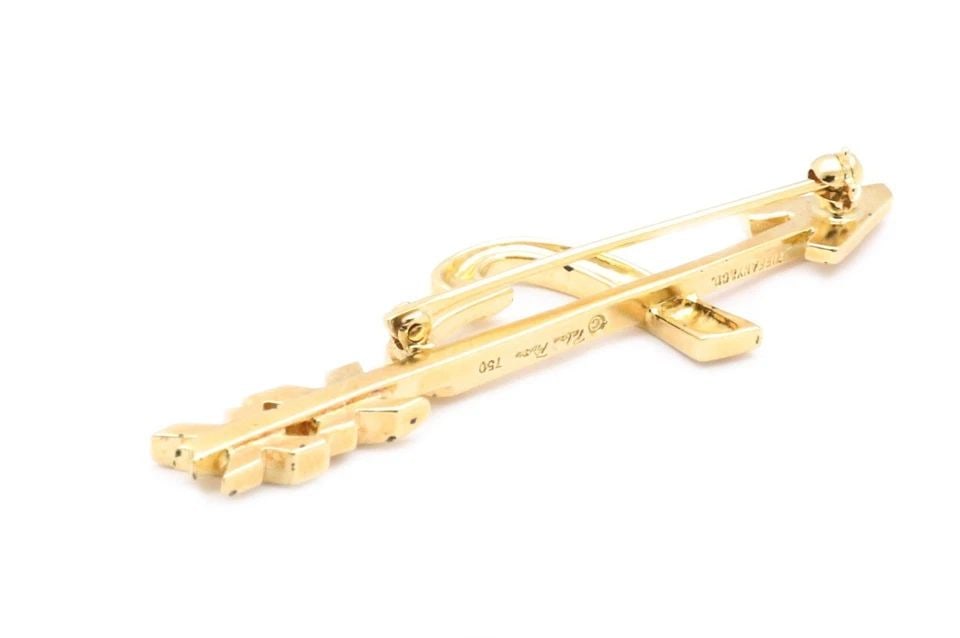 TIFFANY & CO. PICASSO 18K YELLOW GOLD ARROW & HEART X DESIGN PIN: TIFFANY & CO. PICASSO 18K YELLOW GOLD ARROW & HEART X DESIGN PIN Tiffany & Co. Picasso 18k Yellow Gold Arrow & Heart X Design Pin Description This lovely authentic brooch is from Tiffany & Co. by desi