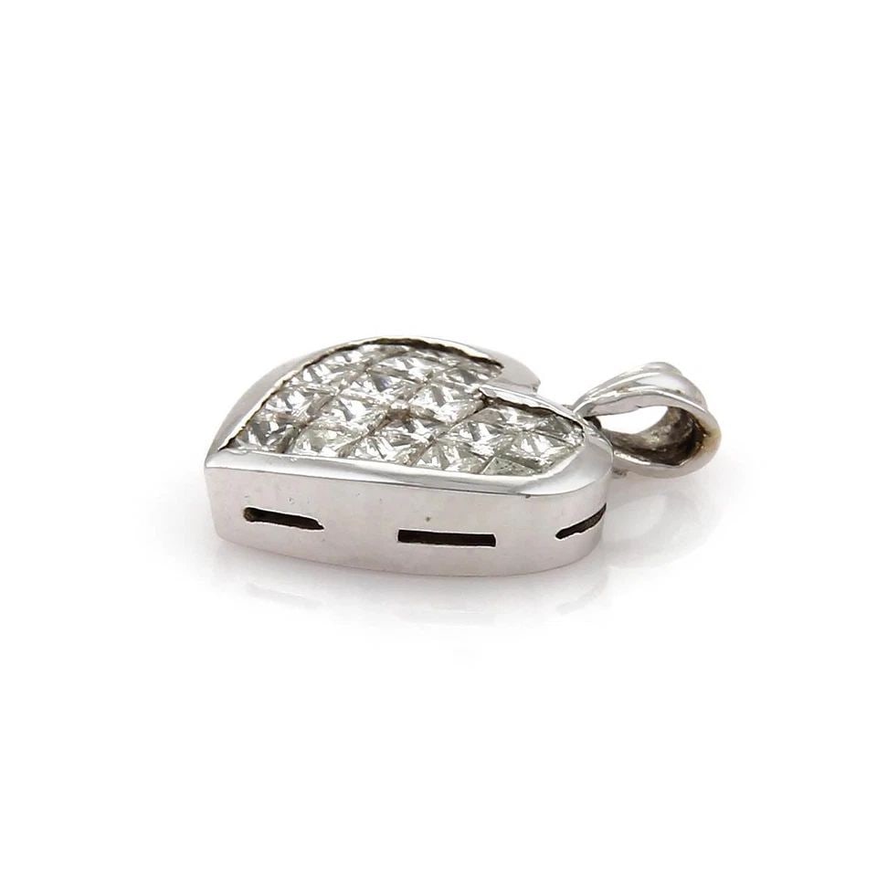 INVISIBLE SET DIAMOND 18K WHITE GOLD HEART PENDANT: INVISIBLE SET DIAMOND 18K WHITE GOLD HEART PENDANT Carat Invisible Set Diamond 18k White Gold Heart Pendant Description This lovely heart pendant is crafted from 18k white gold with a polished finish.