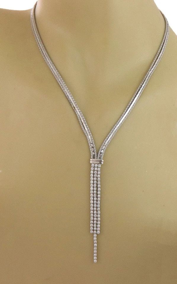 7239 GOLD TASSEL PENDANT NECKLACE 14K WHITE 3 STRAND WHITE STONES: 7239 GOLD TASSEL PENDANT NECKLACE 14K WHITE 3 STRAND WHITE STONES This lovely necklace is crafted from 14k white gold featuring a dangling tassel pendant with three strands of white stones set in 14k 