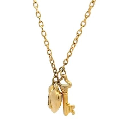 TIFFANY & CO.18K YELLOW GOLD PUFF HEART LOCK & KEY PENDANT NECKLACE: TIFFANY & CO.18K YELLOW GOLD PUFF HEART LOCK & KEY PENDANT NECKLACE This is an authentic Tiffany & Co. necklace; it is crafted in 18k yellow gold with a fine polished finish. The pendant is in the des