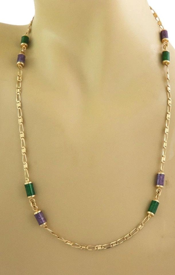 CYLINDER ENAMEL 18K CHAIN PURPLE GREENYELLOW GOLD: CYLINDER ENAMEL 18K CHAIN PURPLE GREENYELLOW GOLD Elegant Purple Green Enamel Cylinder Motifs 18k Yellow Gold Chain Description This elegant necklace is crafted from 18k yellow gold with a slim figaro