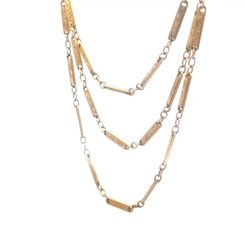 VICTORIAN GOLD NECKLACE 14K YELLOW ETCHED SCROLLS BAR LINK STYLE 31"L: 7117 VICTORIAN GOLD NECKLACE 13-14K YELLOW ETCHED SCROLLS BAR LINK STYLE 31"L This Victorian gold necklace is a vintage piece crafted from 13-14k yellow gold. It features intricate etched scrolls on b