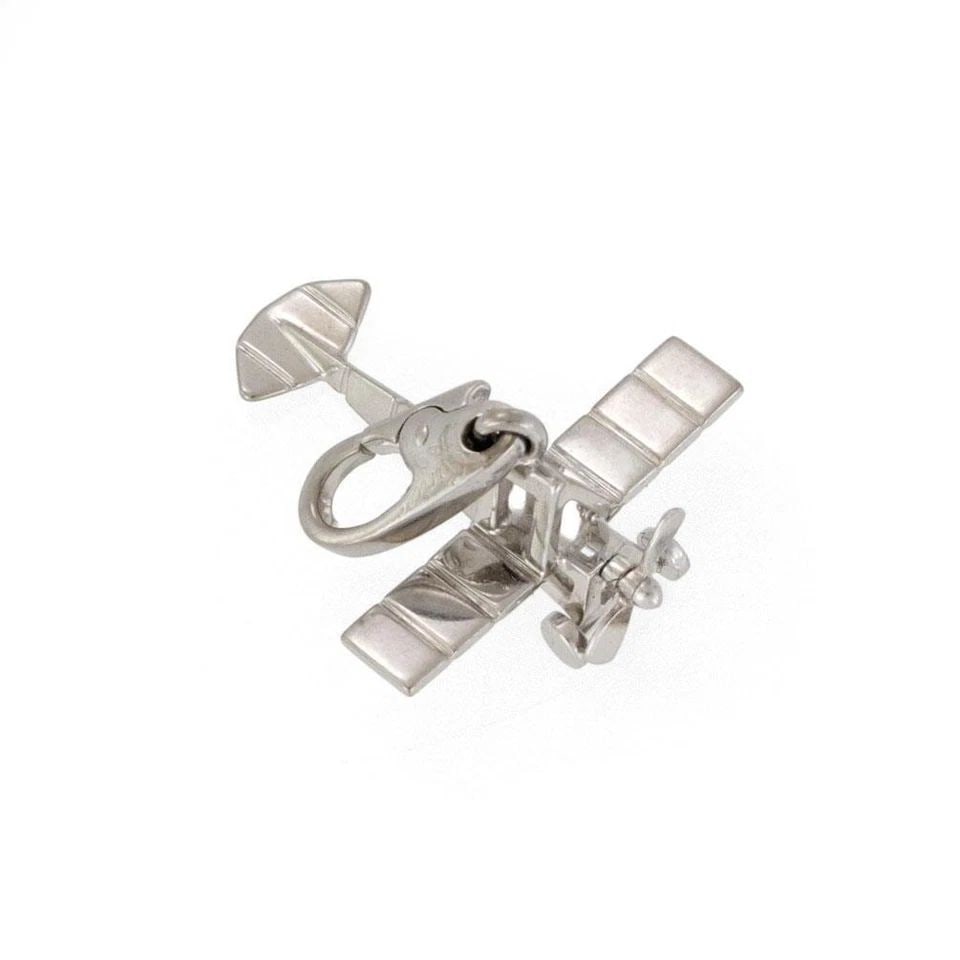VINTAGE CARTIER 18K WHITE GOLD AIRPLANE COLLECTIBLE CHARM: VINTAGE CARTIER 18K WHITE GOLD AIRPLANE COLLECTIBLE CHARM Vintage Cartier 18k White Gold Airplane Collectible Charm Description This is an authentic charm or pendant from Cartier, from 18k white gold 