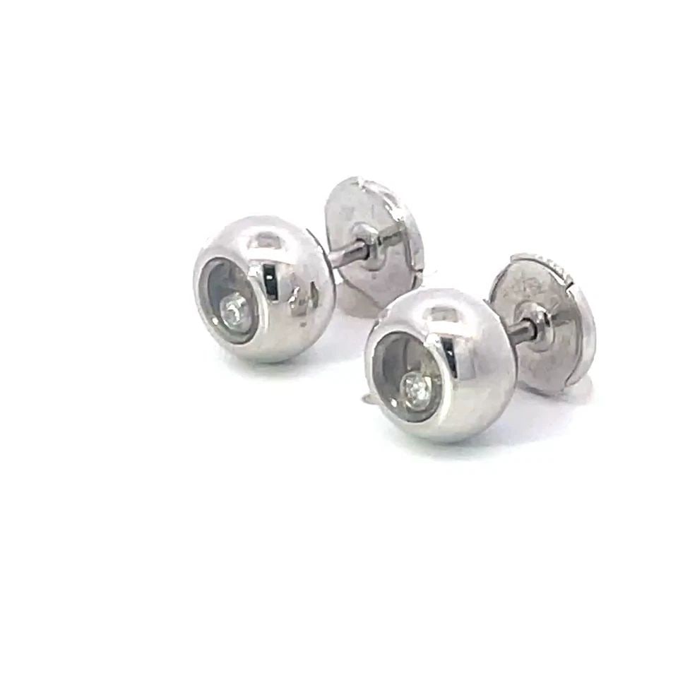 CHOPARD HAPPY DIAMOND GOLD STUD EARRINGS 18K WHITE PUFFED BEAD STYLE: CHOPARD HAPPY DIAMOND GOLD STUD EARRINGS 18K WHITE PUFFED BEAD STYLE From the Happy Diamond Collection by Chopard, these lovely stud earrings are crafted from 18k white gold with a polished finish fea