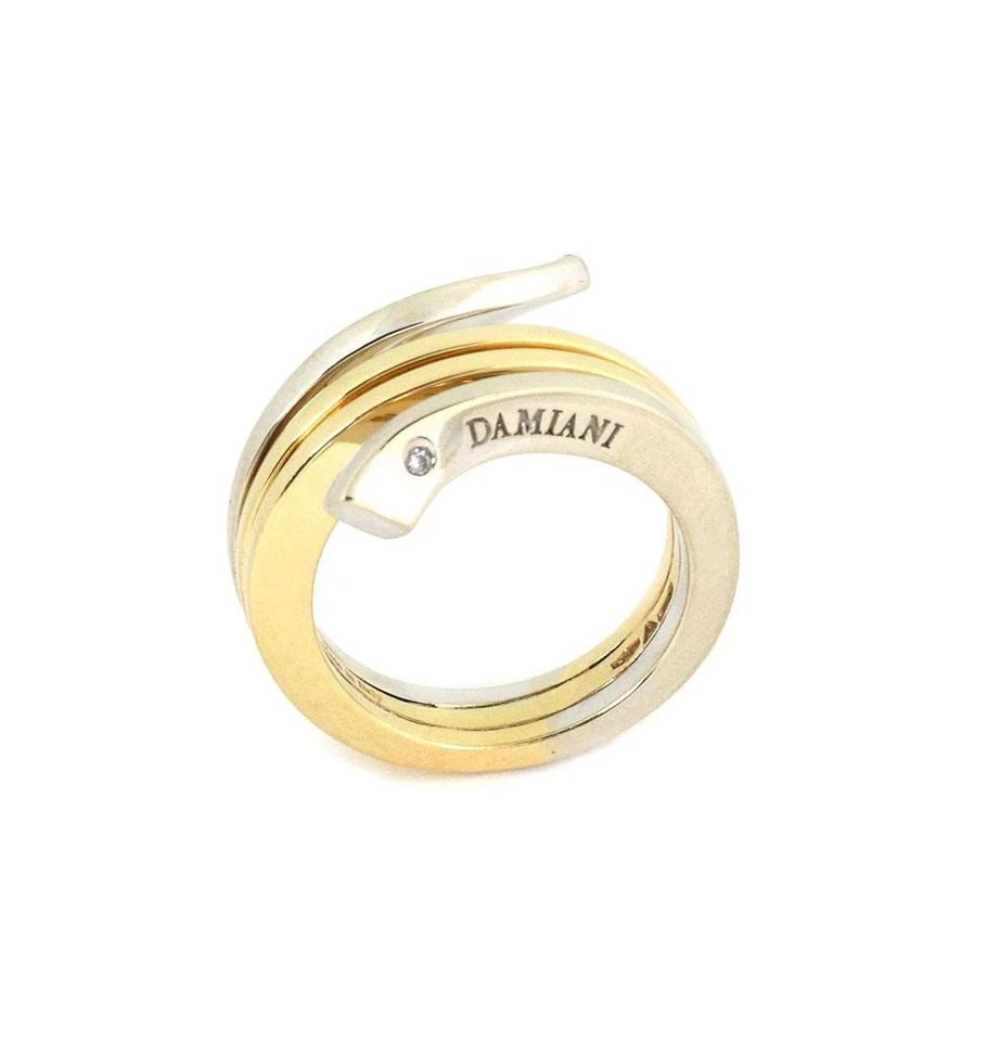 DAMIANI 18K TWO TONE GOLD 4 ROWS BYPASS DESIGN BAND RING: DAMIANI 18K TWO TONE GOLD 4 ROWS BYPASS DESIGN BAND RING Damiani 18k Two Tone Gold 4 Rows Bypass Design Band Ring Description This lovely authentic ring is by Damiani, it is crafted from 18k white and