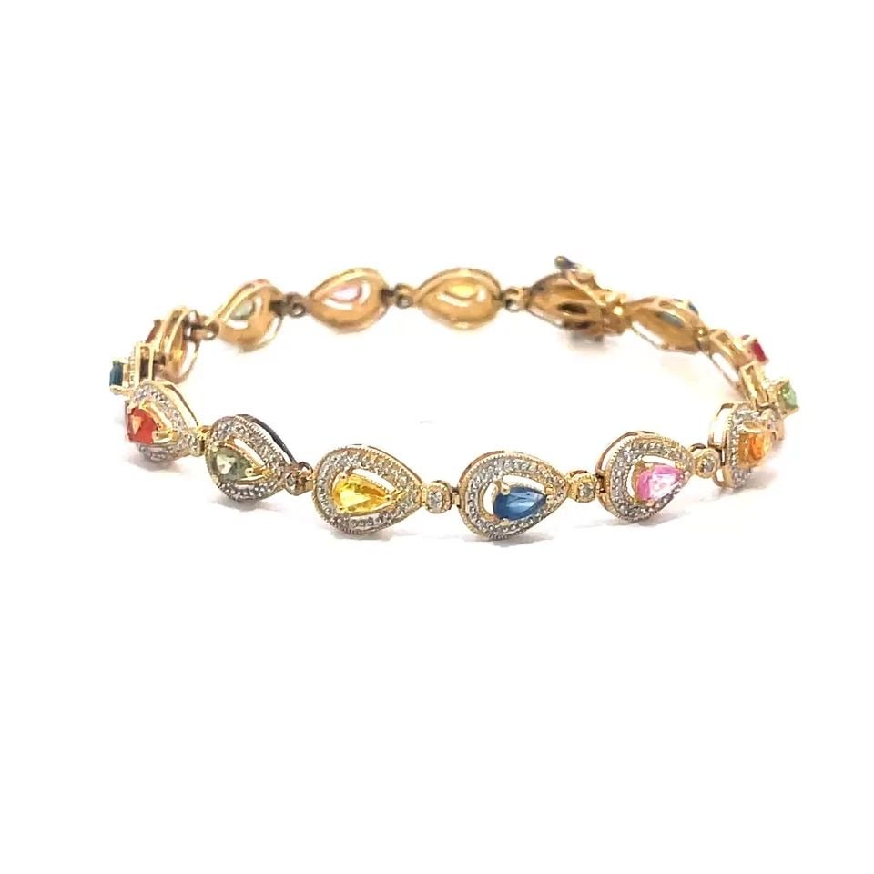 DIAMOND GOLD BRACELET 14K YELLOW MULTI-COLOR SAPPHIRE PEAR SHAPE LINKS: The gold bracelet features pear shaped links , it is crafted in 14k yellow gold with multi-color pear shaped sapphire accented with pring set diamonds . This elegant bracelet is perfect for special oc