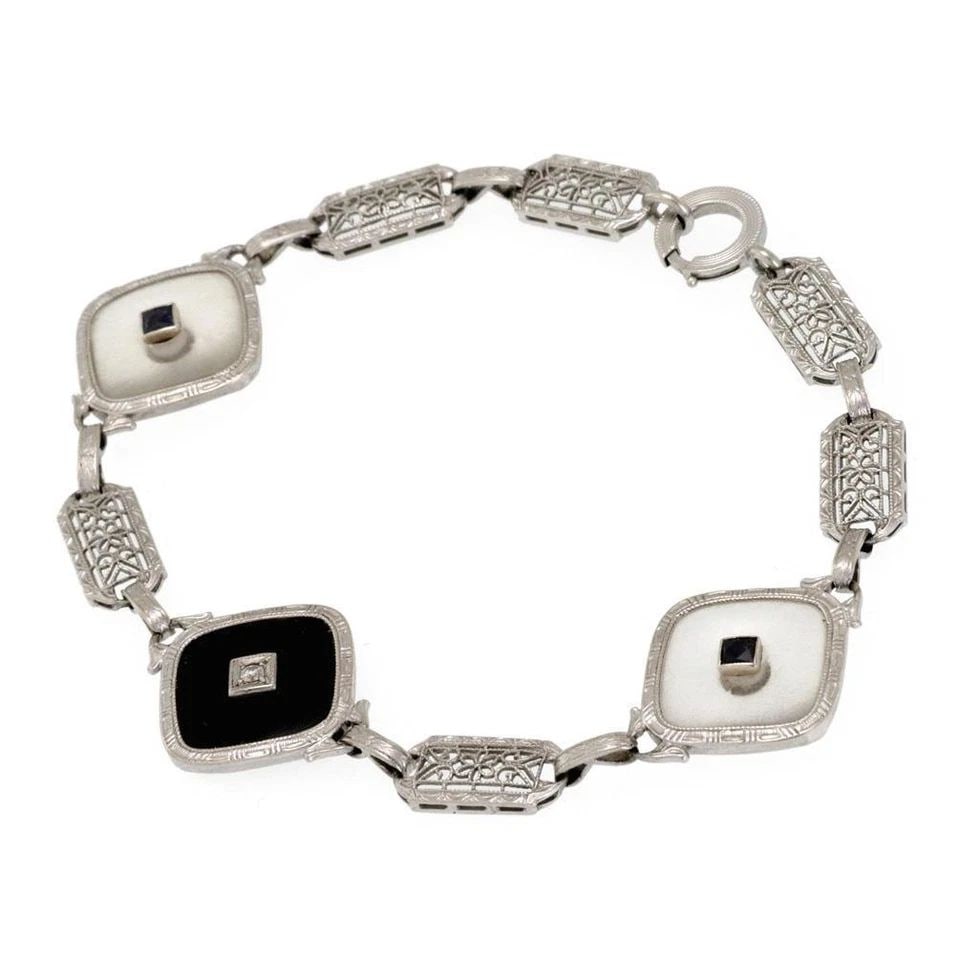 ART DECO DIAMOND SAPPHIRE ONYX CAMPHOR GLASS 14K GOLD FILIGREE BRACELET: ART DECO DIAMOND SAPPHIRE ONYX CAMPHOR GLASS 14K GOLD FILIGREE BRACELET Art Deco Diamond Sapphire Onyx Camphor Glass 14k Gold Filigree Bracelet Description This is an Art Deco bracelet, crafted from 1