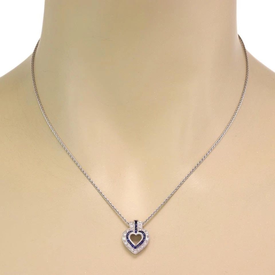 DIAMOND SAPPHIRE HEART PENDANT & CHAIN NECKLACE IN PLATINUM: DIAMOND SAPPHIRE HEART PENDANT & CHAIN NECKLACE IN PLATINUM Platinum Diamond Sapphire Heart Pendant & Chain Necklace Description This lovely open heart pendant and wheat woven chain is crafted from pl