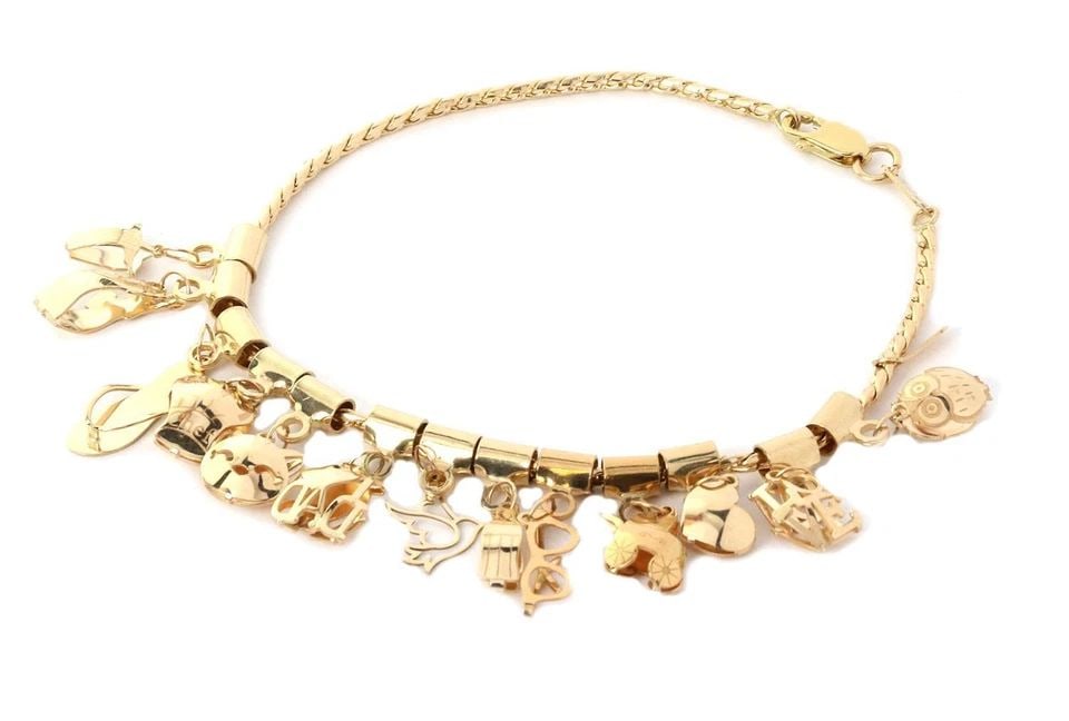 14K YELLOW GOLD 13 DANGLING MULTI-CHARMS CHAIN BRACELET: 14K YELLOW GOLD 13 DANGLING MULTI-CHARMS CHAIN BRACELET 14k Yellow Gold 13 Dangling Multi-Charms Chain Bracelet Description This is a multi dangling charms bracelet, it is crafted from 14k yellow gold
