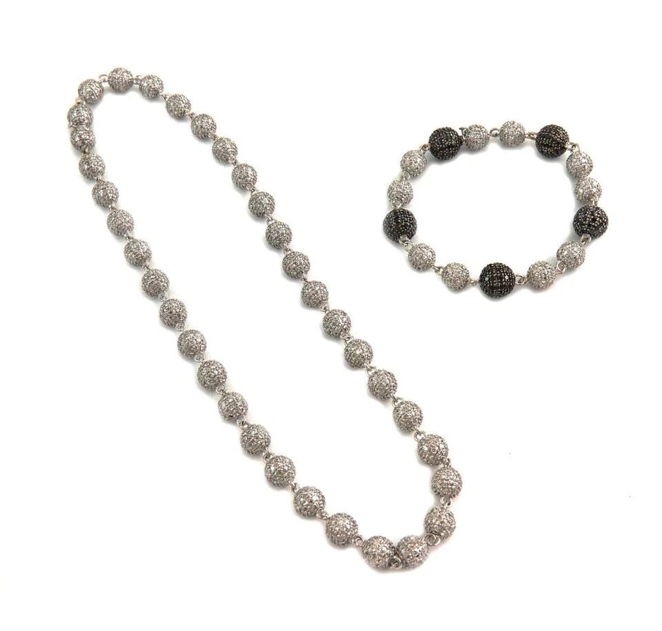 DIAMOND BEAD NECKLACE BRACELET SET IN 14KT GOLD: DIAMOND BEAD NECKLACE BRACELET SET IN 14KT GOLD DIAMOND BEAD NECKLACE BRACELET SET IN 14KT GOLD This Diamond Bead Necklace Bracelet Set in 14kt Gold features a round pendant with a black fancy diamond