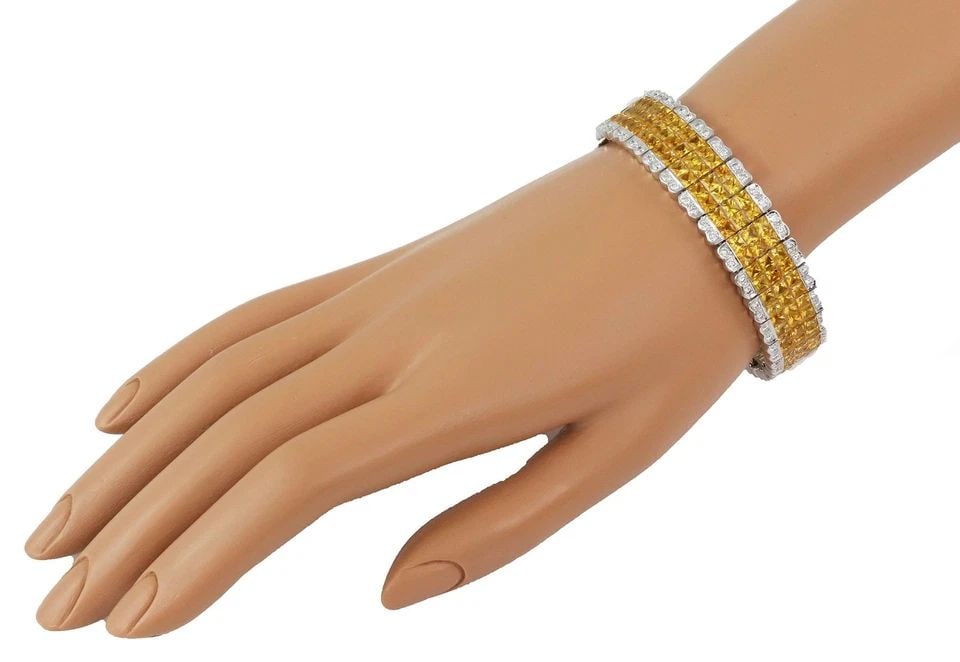 ESTATE 38.00CT YELLOW SAPPHIRE & DIAMOND 18K WHITE GOLD 15.2MM WIDE BRACELET: ESTATE 38.00CT YELLOW SAPPHIRE & DIAMOND 18K WHITE GOLD 15.2MM WIDE BRACELET ESTATE 38.00CT YELLOW SAPPHIRE & DIAMOND 18K WHITE GOLD 15.2MM WIDE BRACELET Estate 38.00ct Yellow sapphire & Diamond 18k W