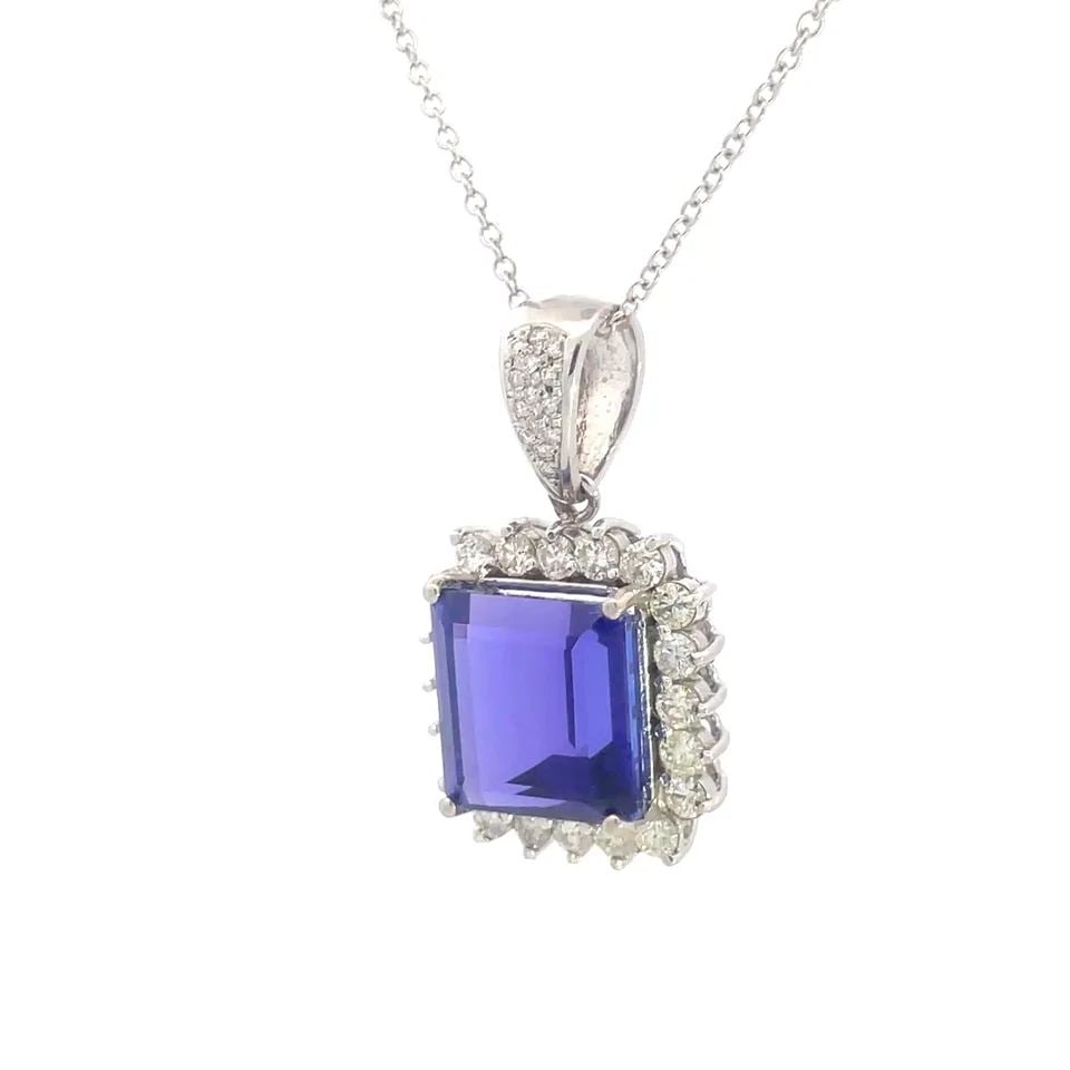 TANZANITE & DIAMOND GOLD PENDANT 14K WHITE HALO STYLE W/CHAIN 27 CT: TANZANITE & DIAMOND GOLD PENDANT 14K WHITE HALO STYLE W/CHAIN 27 CT TANZANITE & DIAMOND GOLD PENDANT 14K WHITE HALO STYLE W/CHAIN 27 CT This is a stunning pendant and chain necklace; it is crafted fro