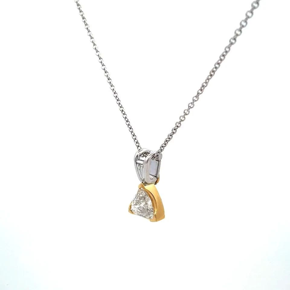 NECKLACE TRILLION CUT DIAMOND 18K GOLD PENDANT 14K WHITE GOLD CHAIN: NECKLACE TRILLION CUT DIAMOND 18K GOLD PENDANT 14K WHITE GOLD CHAIN This 18k gold pendant with a trillion cut diamond is a stunning piece of fine jewelry for women. The pendant is set with a white tri
