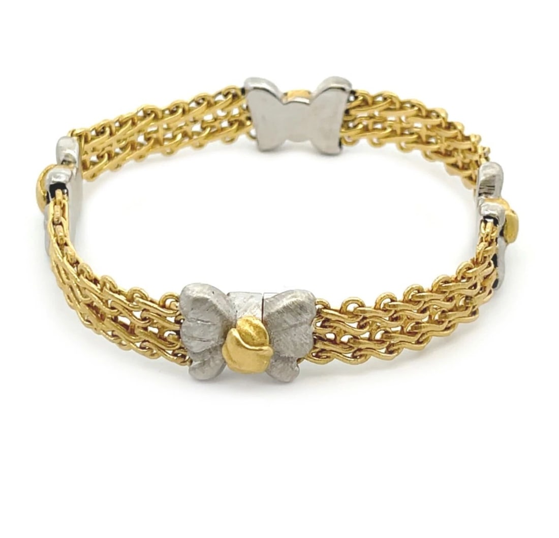 BUCCELLATI 18K TWO TONE GOLD BUTTERFLY MOTIFS CHAIN BRACELET: BUCCELLATI 18K TWO TONE GOLD BUTTERFLY MOTIFS CHAIN BRACELET BUCCELLATI 18K TWO TONE GOLD BUTTERFLY MOTIFS CHAIN BRACELET Buccellati Butterfly Motifs 18k Two Tone Gold Chain Bracelet Description This 