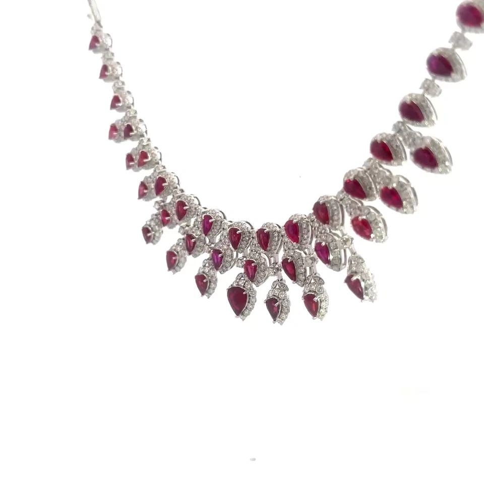 RUBY DIAMOND GOLD BIB NECKLACE 18K WHITE 13.5CT TEARDROP 3 ROW DESIGN: RUBY DIAMOND GOLD BIB NECKLACE 18K WHITE 13.5CT TEARDROP 3 ROW DESIGN RUBY DIAMOND GOLD BIB NECKLACE 18K WHITE 13.5CT TEARDROP 3 ROW DESIGN This gorgeous eye-catching bib necklace is crafted from 18k 