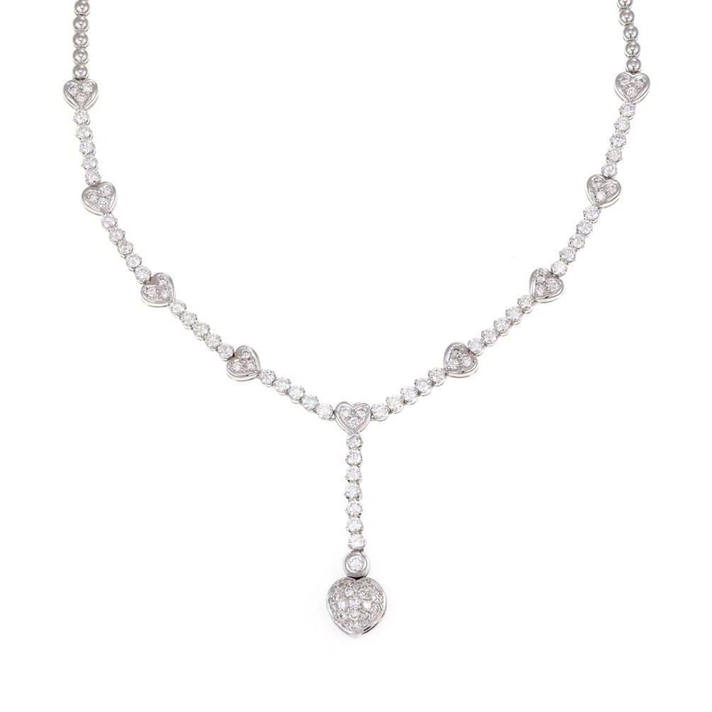 DIAMOND LARIAT NECKLACE 18K WHITE GOLD HEART MOTIF: DIAMOND LARIAT NECKLACE 18K WHITE GOLD HEART MOTIF DIAMOND LARIAT NECKLACE 18K WHITE GOLD HEART MOTIF The Diamond Lariat Necklace in 18k White Gold with a Heart Motif is a stunning piece of fine jewel