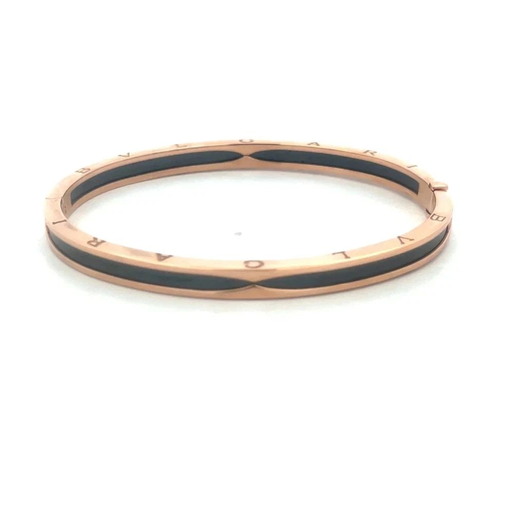 BVLGARI B.ZERO1 GOLD BRACELET 18K ROSE BLACK CERAMIC HINGED BANGLE W/BOX 7.25": BVLGARI B.ZERO1 GOLD BRACELET 18K ROSE BLACK CERAMIC HINGED BANGLE W/BOX 7.25" The Bvlgari B.zero1 gold Bracelet is a luxurious and elegant piece of fine jewelry. Made from 18k rose gold with black ce