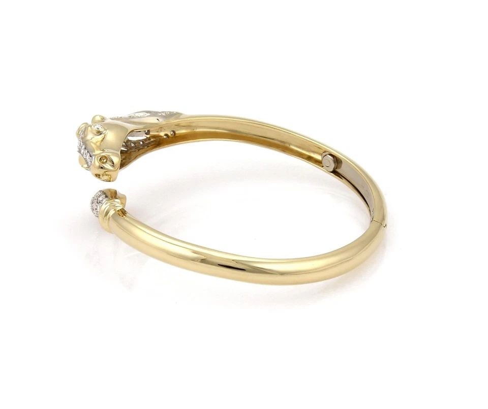 18K HORSE BYPASS BRACELET ESTATE 1.10CT DIAMOND TWO TONE GOLD BANGLE: 18K HORSE BYPASS BRACELET ESTATE 1.10CT DIAMOND TWO TONE GOLD BANGLE 18K HORSE BYPASS BRACELET ESTATE 1.10CT DIAMOND TWO TONE GOLD BANGLE Estate 1.10ct Diamond 18k Two Tone Gold Horse Bypass Bracelet 
