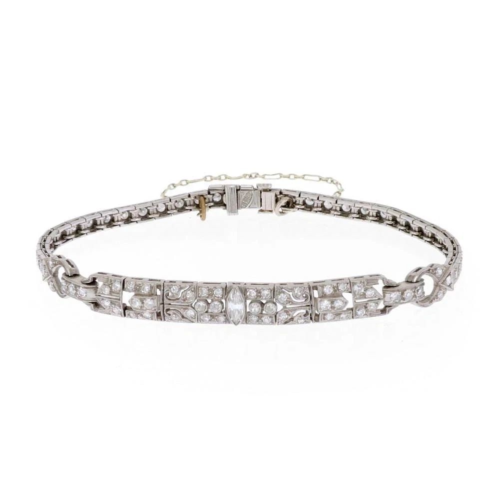 DIAMOND PLATINUM BRACELET FLORAL MILGRAIN DESIGN ART DECO: DIAMOND PLATINUM BRACELET FLORAL MILGRAIN DESIGN ART DECO DIAMOND PLATINUM BRACELET FLORAL MILGRAIN DESIGN ART DECO This beautiful Art Deco bracelet is crafted from platinum, the 2.5 inches long cente