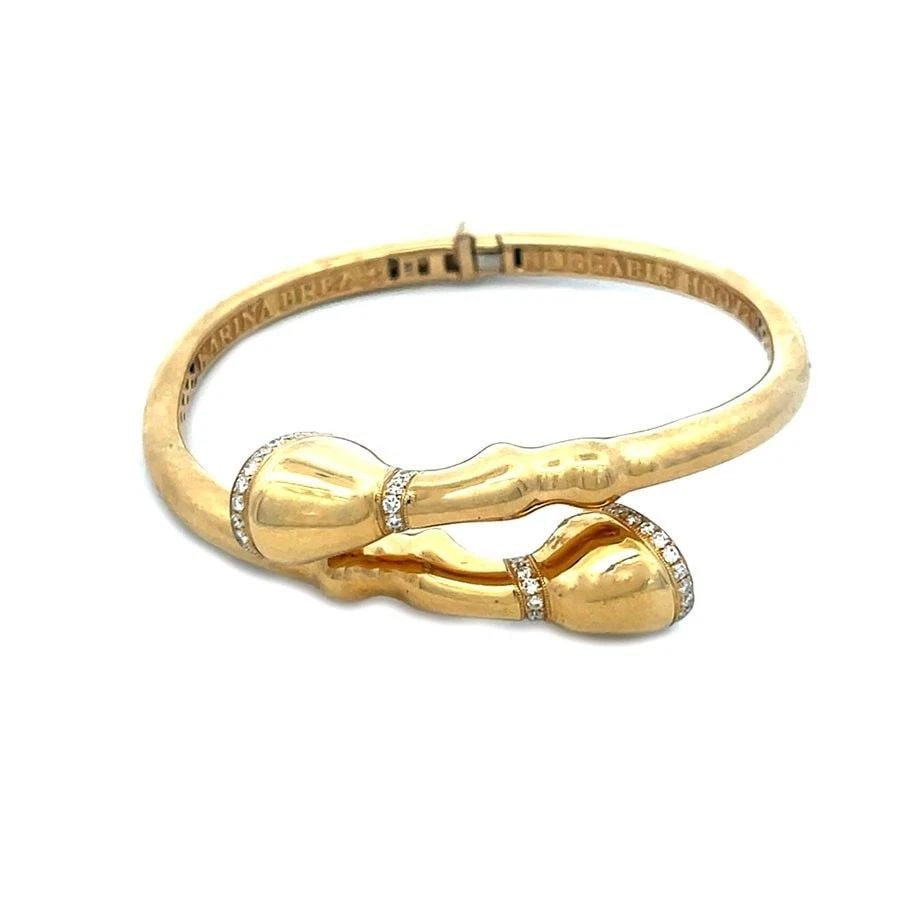 KARINA BREZ DIAMOND GOLD BRACELET BYPASS HORSE HOOVES FLEX BANGLE: KARINA BREZ DIAMOND GOLD BRACELET BYPASS HORSE HOOVES FLEX BANGLE KARINA BREZ DIAMOND GOLD BRACELET BYPASS HORSE HOOVES FLEX BANGLE This eye-catching equestrian bracelet is by designer Karina Brez, fr
