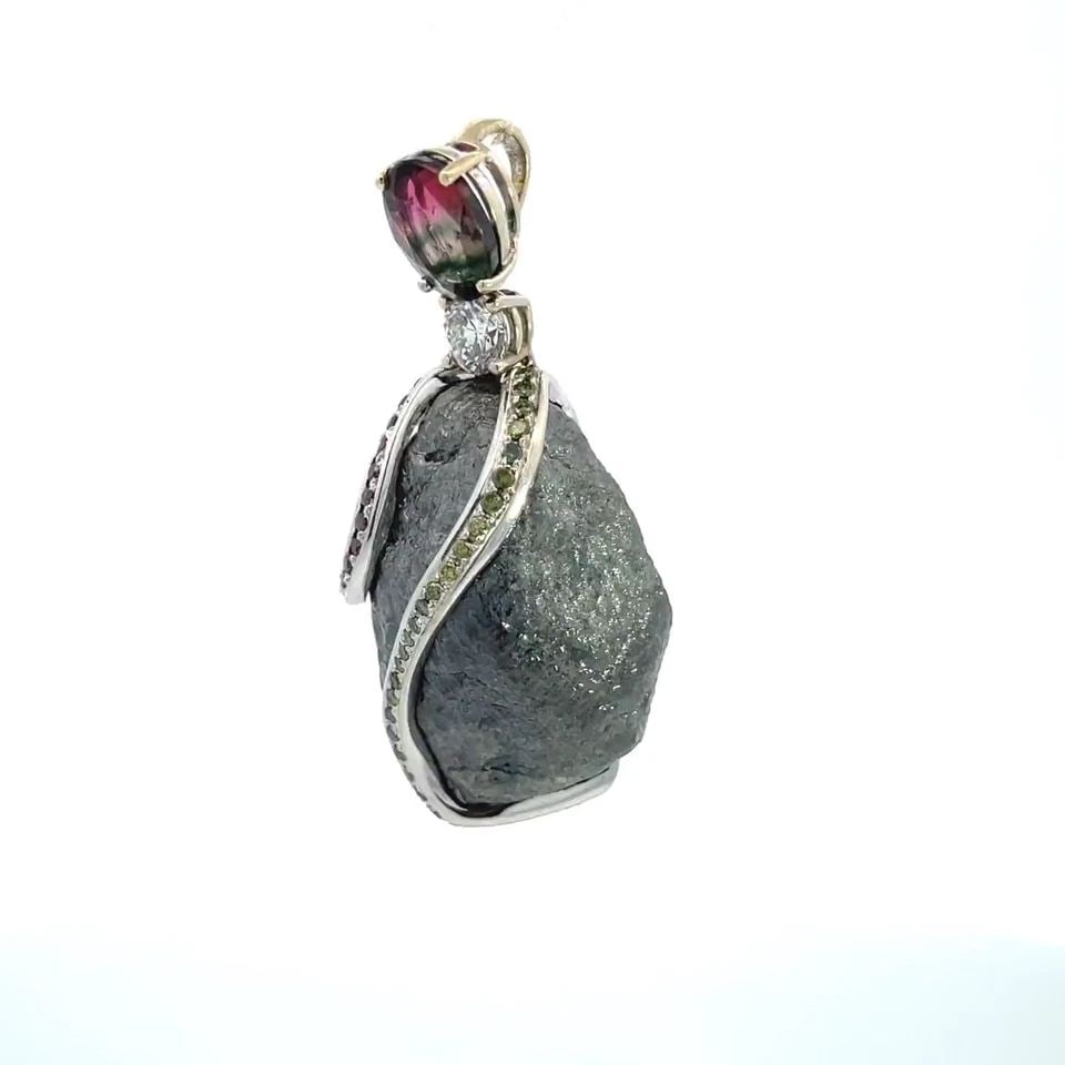 69CT DIAMOND TOURMALINE SMALL DIAMOND & GEMS 18K GOLD PENDANT: 69CT DIAMOND TOURMALINE SMALL DIAMOND & GEMS 18K GOLD PENDANT 69CT DIAMOND TOURMALINE SMALL DIAMOND & GEMS 18K GOLD PENDANT This is a magnificent pendant, it features a large raw uncut 69 carat diamon