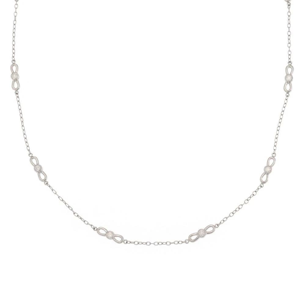 TIFFANY & CO NECKLACE DIAMOND 18K WHITE GOLD 10 BOW MOTIFS CHAIN: TIFFANY & CO NECKLACE DIAMOND 18K WHITE GOLD 10 BOW MOTIFS CHAIN The Tiffany & Co. Necklace features a stunning design with 10 bow motifs and a chain made of 18k white gold. Crafted in the United Stat