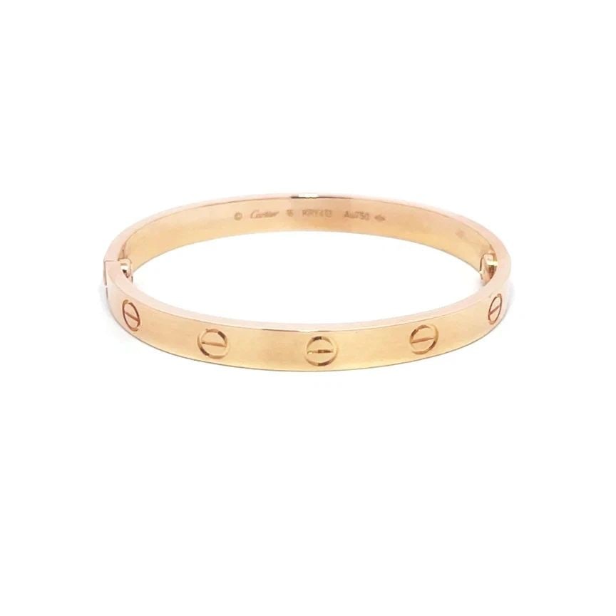 CARTIER LOVE GOLD BANGLE CLASSIC MODEL 18K ROSE SIZE 16 BOX & PAPER: CARTIER LOVE GOLD BANGLE CLASSIC MODEL 18K ROSE SIZE 16 BOX & PAPER CARTIER LOVE GOLD BANGLE CLASSIC MODEL 18K ROSE SIZE 16 BOX & PAPER This elegant bangle is by Cartier, from 18k rose gold, it featur