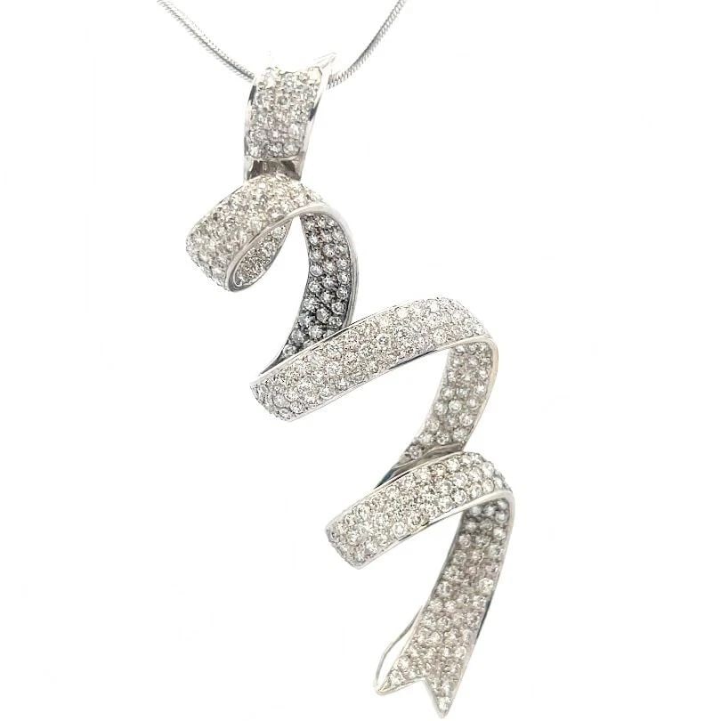 DIAMOND RIBBON GOLD PENDANT 18K WHITE 14K WHITE GOLD SNAKE CHAIN: DIAMOND RIBBON GOLD PENDANT 18K WHITE 14K WHITE GOLD SNAKE CHAIN DIAMOND RIBBON GOLD PENDANT 18K WHITE 14K WHITE GOLD SNAKE CHAIN This is a gorgeous pendant and chain necklace. The pendant is 18k whit