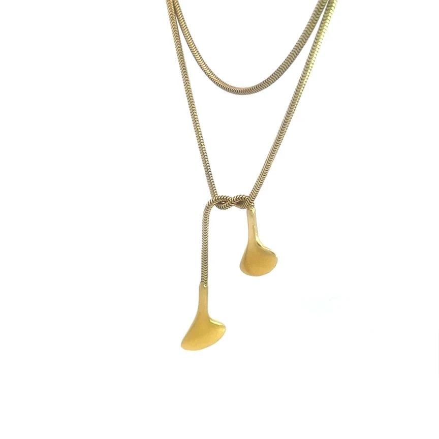 TIFFANY & CO. GOLD LARIAT NECKLACE 18K YELLOW LONG SNAKE CHAIN: TIFFANY & CO. GOLD LARIAT NECKLACE 18K YELLOW LONG SNAKE CHAIN TIFFANY & CO. GOLD LARIAT NECKLACE 18K YELLOW LONG SNAKE CHAIN The Tiffany & Co. Gold Lariat Necklace is a stunning piece of vintage jewe