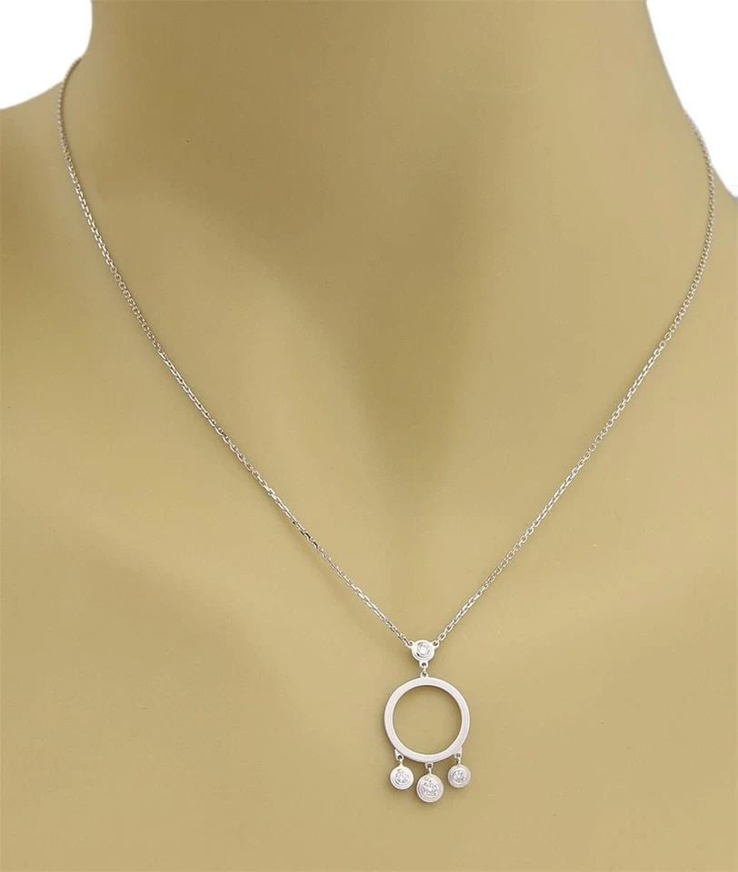 CARTIER DIAMOND GOLD NECKLACE 18K WHITE CIRCLE PENDANT DANGLING MOTIFS: CARTIER DIAMOND GOLD NECKLACE 18K WHITE CIRCLE PENDANT DANGLING MOTIFS CARTIER DIAMOND GOLD NECKLACE 18K WHITE CIRCLE PENDANT DANGLING MOTIFS The Cartier Diamond Gold Necklace features a stunning whit