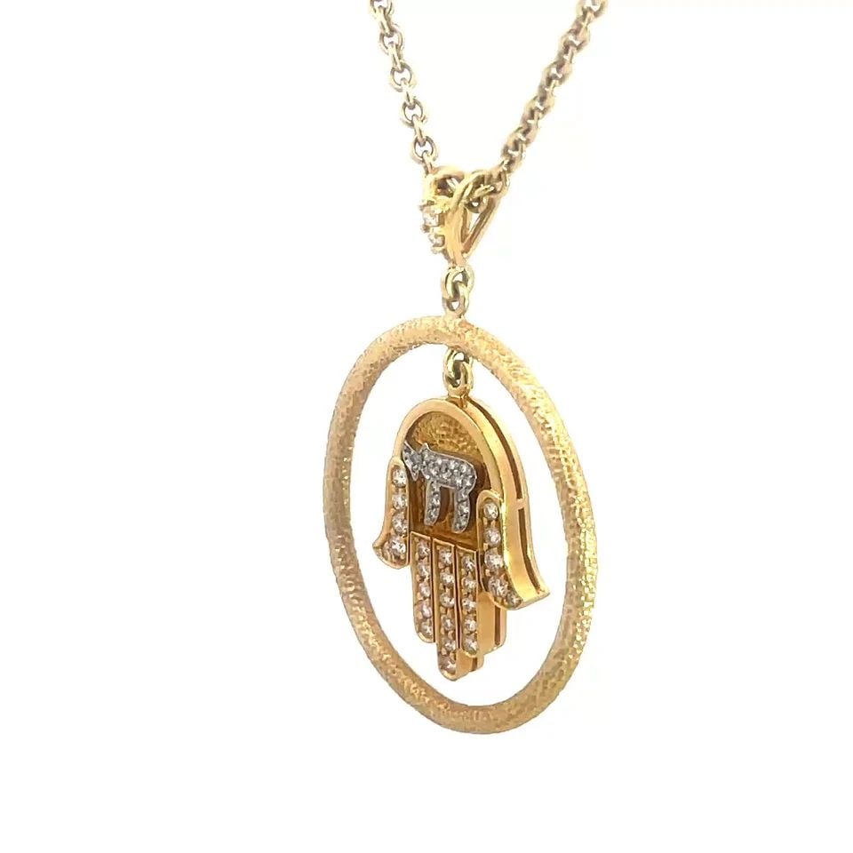 DIAMOND GOLD HAMSA CHAI NECKLACE 18K YELLOW CIRCLE DANGLE PENDANT W/ CHAIN: DIAMOND GOLD HAMSA CHAI NECKLACE 18K YELLOW CIRCLE DANGLE PENDANT W/ CHAIN DIAMOND GOLD HAMSA CHAI NECKLACE 18K YELLOW CIRCLE DANGLE PENDANT W/ CHAIN The Diamond Gold Hamsa with Chai Pendant dangles i