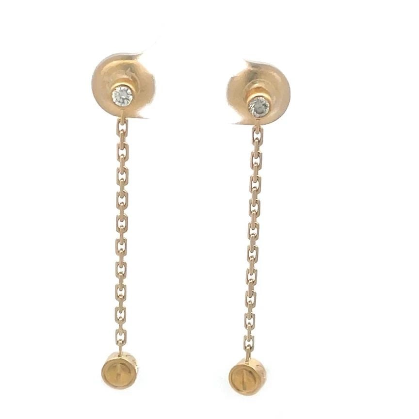 CARTIER LOVE GOLD EARRINGS NATURAL DIAMOND 18K SCREW MOTIF DROP STYLE: CARTIER LOVE GOLD EARRINGS NATURAL DIAMOND 18K SCREW MOTIF DROP STYLE These elegant long dangle earrings are by Cartier from the Love Collection. They are a luxurious and stylish piece of fine jewelry