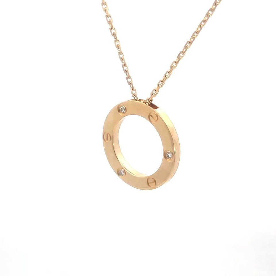 71117 CARTIER LOVE GOLD NECKLACE DIAMOND 18K YELLOW CIRCLE PENDANT W/BOX & PAPER: 71117 CARTIER LOVE GOLD NECKLACE DIAMOND 18K YELLOW CIRCLE PENDANT W/BOX & PAPER The Cartier Love Gold Necklace is a stunning piece of fine jewelry featuring the open style circle pendant with screw m