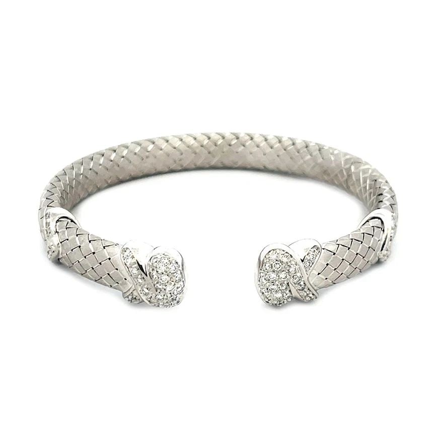 DIAMOND GOLD CUFF BRACELET 18K WHITE PAVE SET BASKET WEAVE STYLE ARIMAR: DIAMOND GOLD CUFF BRACELET 18K WHITE PAVE SET BASKET WEAVE STYLE ARIMAR DIAMOND GOLD CUFF BRACELET 18K WHITE PAVE SET BASKET WEAVE STYLE ARIMAR The Diamond Gold Cuff Bracelet signed Arimar is a stunni