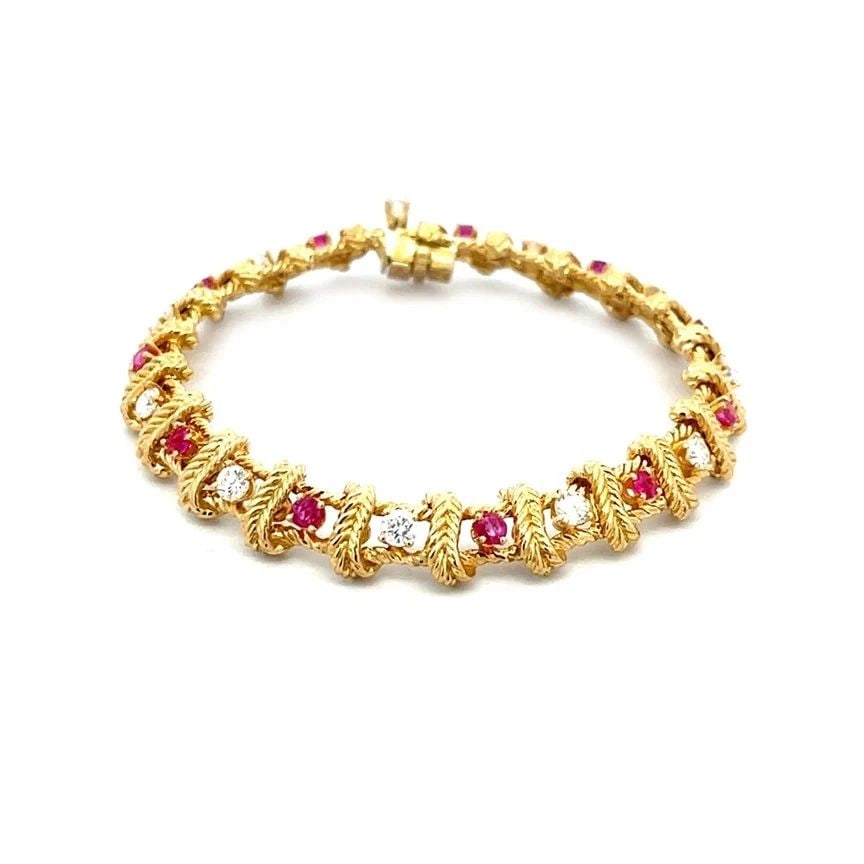 PLACE VENDOME DIAMOND RUBY GOLD BRACELET 18K YELLOW LEAF CROSS BAR DESIGN: PLACE VENDOME DIAMOND RUBY GOLD BRACELET 18K YELLOW LEAF CROSS BAR DESIGN This 18k yellow gold bracelet by Place Vendome, it features a beautiful design with square section and leaf style cross bars, 