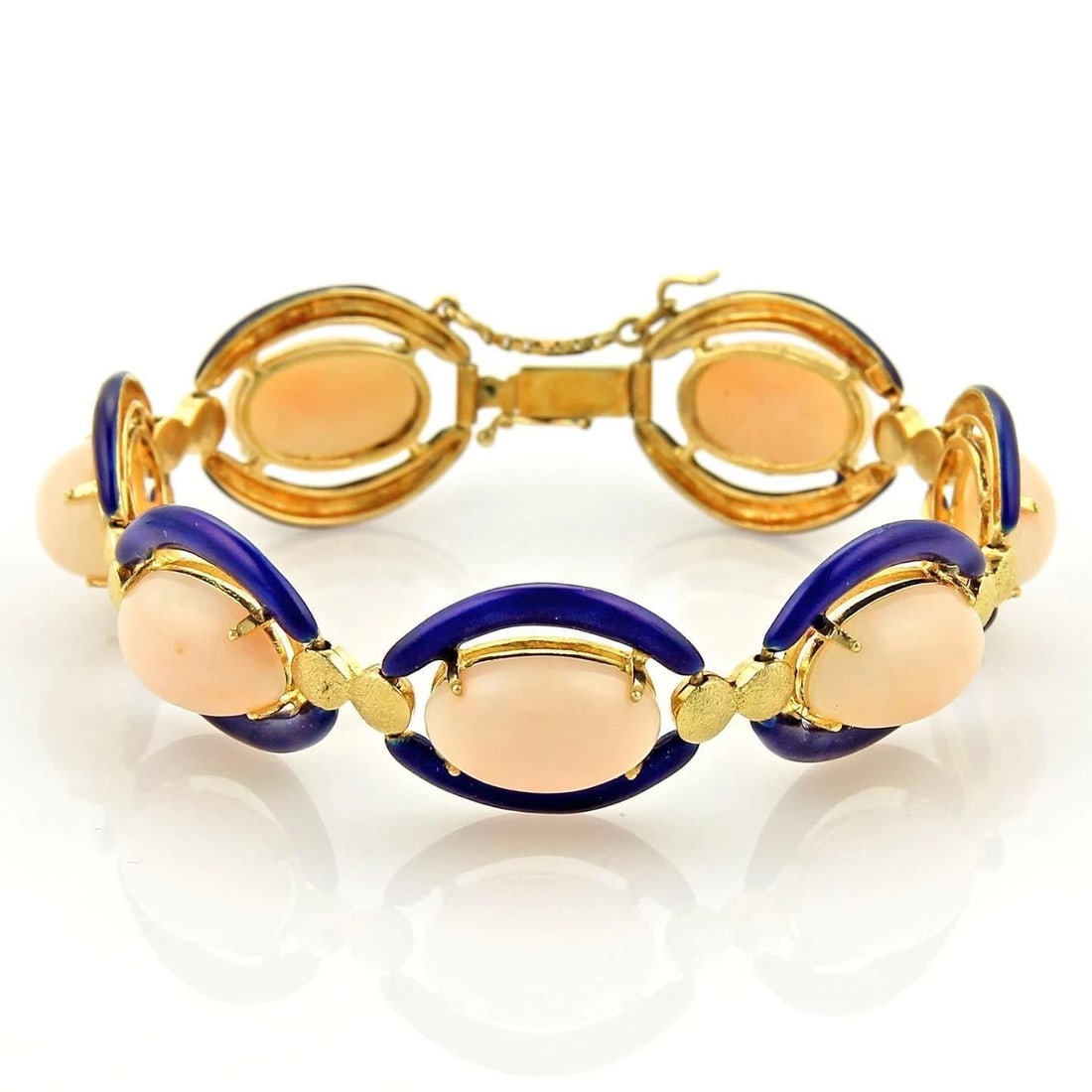 ANGEL SKIN CORAL GOLD BRACELET ENAMEL 14K YELLOW OVAL LINKS STYLE: ANGEL SKIN CORAL GOLD BRACELET ENAMEL 14K YELLOW OVAL LINKS STYLE ANGEL SKIN CORAL GOLD BRACELET ENAMEL 14K YELLOW OVAL LINKS STYLE The Angel Skin Coral Gold Bracelet is a stunning piece of vintage an