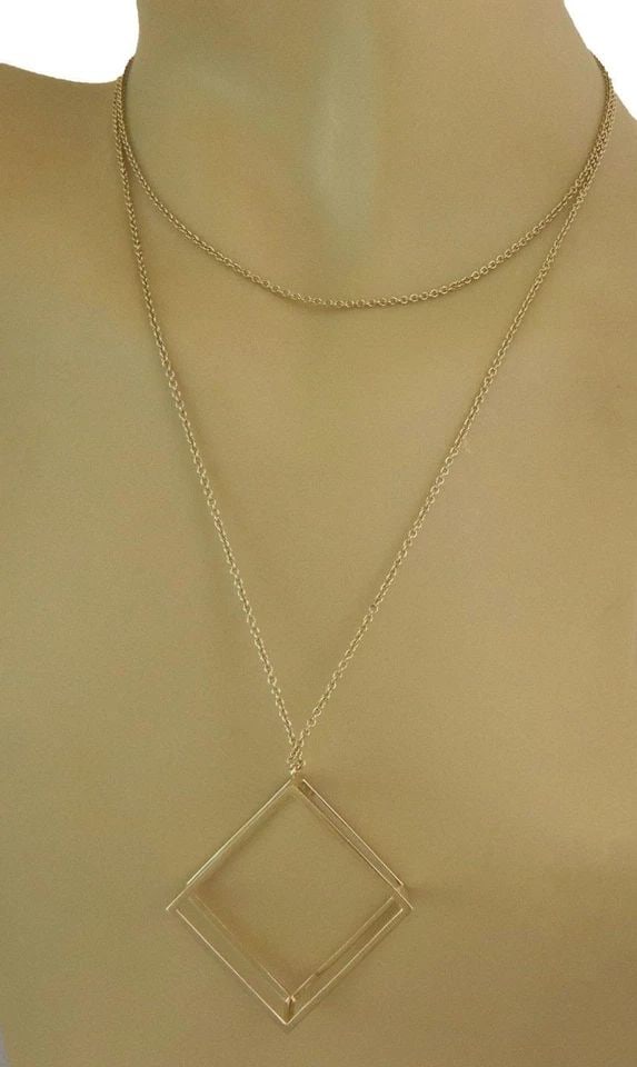 PENDANT DODECAHEDRON SHAPE 18K YELLOW GOLD OPEN 3D & 38" LONG CHAIN: PENDANT DODECAHEDRON SHAPE 18K YELLOW GOLD OPEN 3D & 38" LONG CHAIN This pendant features a unique dodecahedron shape design in 18k yellow gold, complemented by a 38" long oval link chain. The open 3D
