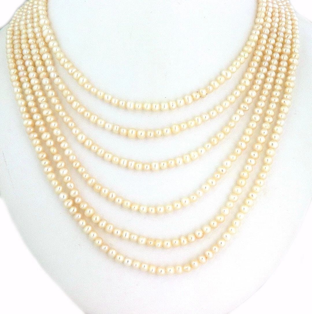 PEARLS MULTI-STRAND GOLD NECKLACE 18K YELLOW LAYERED LONG STRANDS: PEARLS MULTI-STRAND GOLD NECKLACE 18K YELLOW LAYERED LONG STRANDS PEARLS MULTI-STRAND GOLD NECKLACE 18K YELLOW LAYERED LONG STRANDS This beautiful long vintage necklace features a 32 inches long 6 str