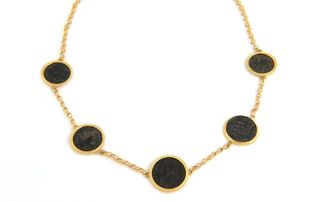 COIN NECKLACE 22KT GOLD WITH FIGURE ESTATE: COIN NECKLACE 22KT GOLD WITH FIGURE ESTATE COIN NECKLACE 22KT GOLD WITH FIGURE ESTATE This Coin Necklace is a luxurious piece of fine jewelry made of 22kt yellow gold. The pendant shape of the necklac